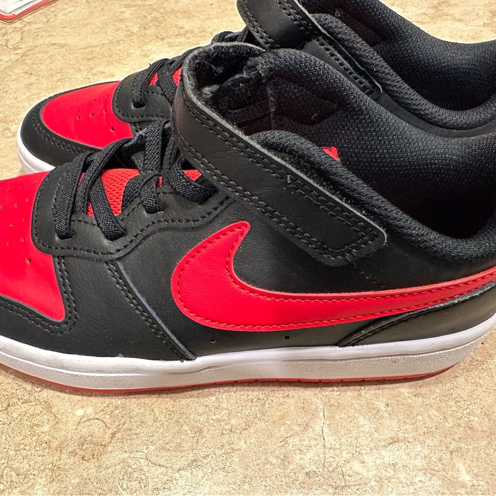 Red and black kids court shoes. Worn once